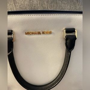 MK medium black/white bag fairly new. It is super cute and you can mix and match
